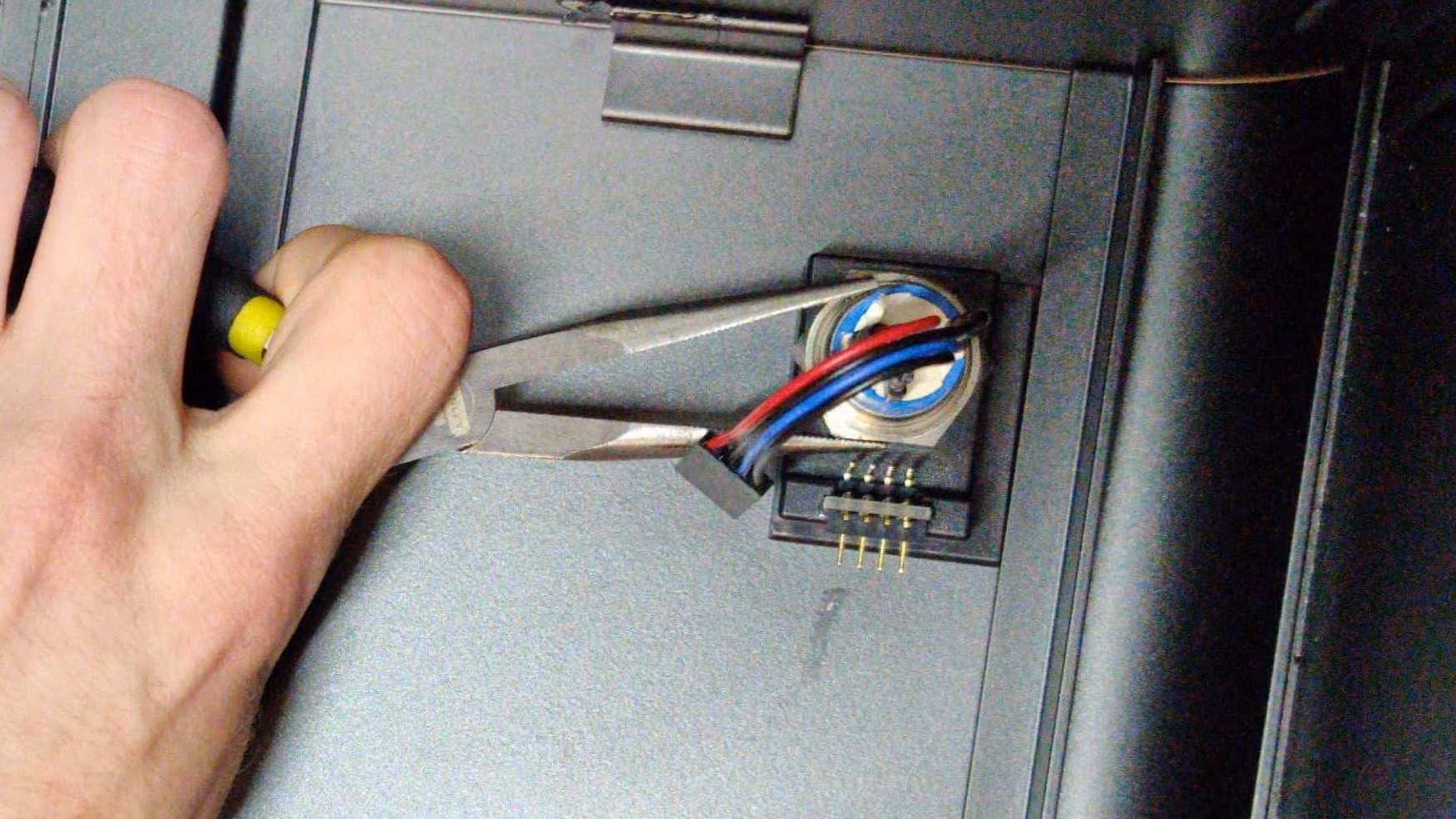 Needle-nose pliers can help with unscrewing the nut